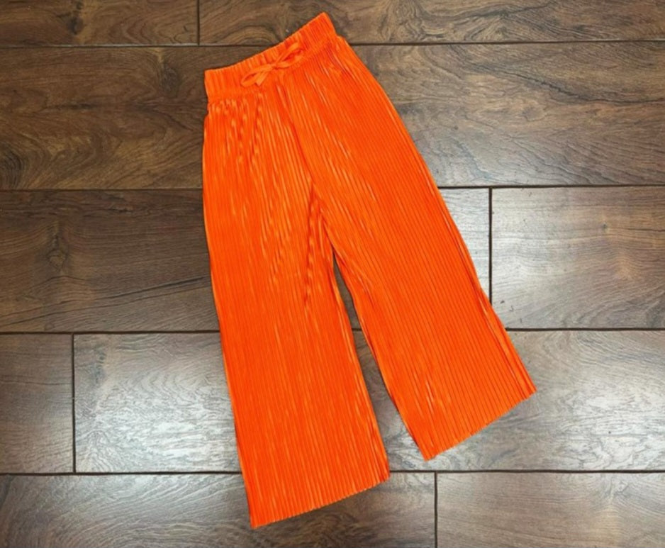 girls coral pleated trousers