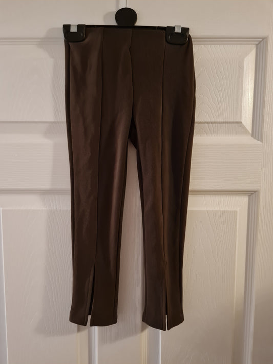 Brown leggings with front slit.